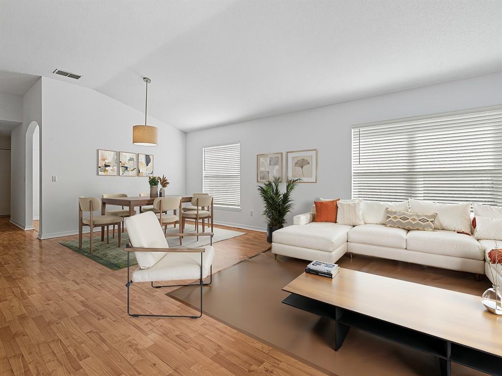 3016 Andover Court Mount Dora, FL 32757 - Photo 11 of 71 a living room with furniture and a large window