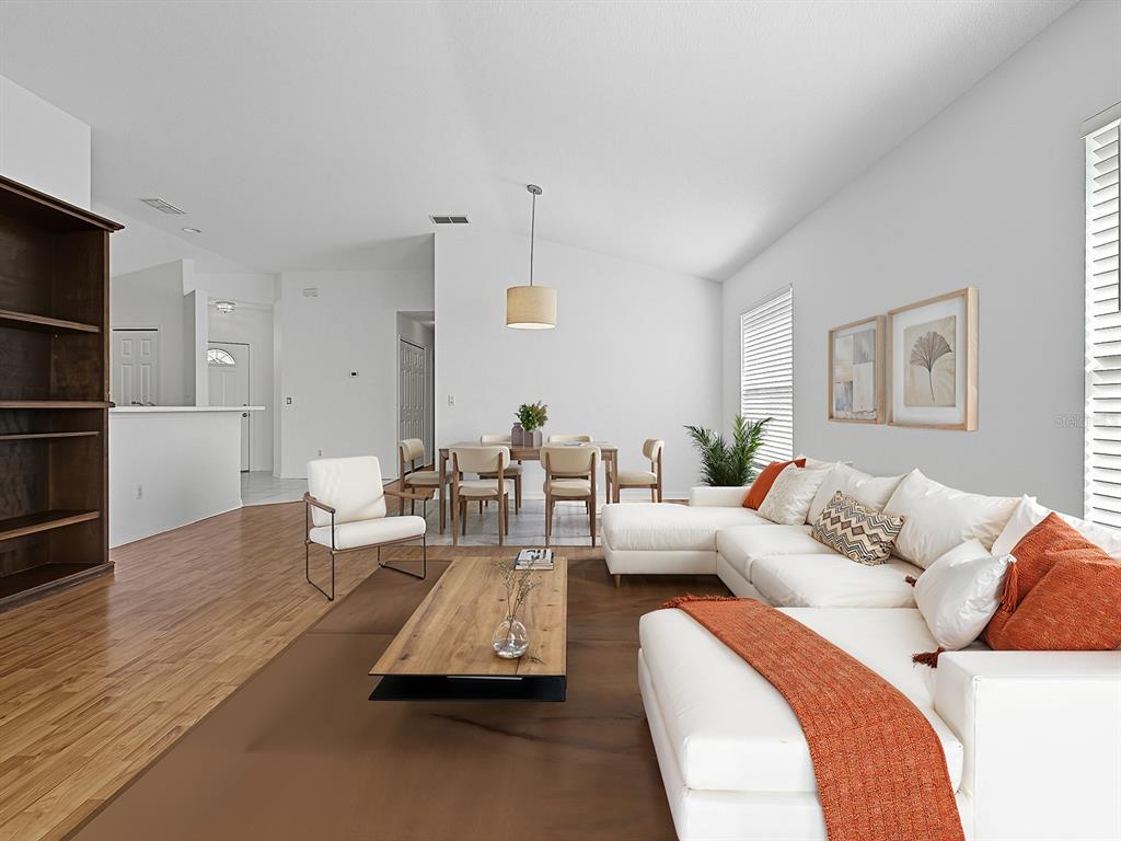 3016 Andover Court Mount Dora, FL 32757 - Photo 13 of 71 a living room with furniture and a wooden floor