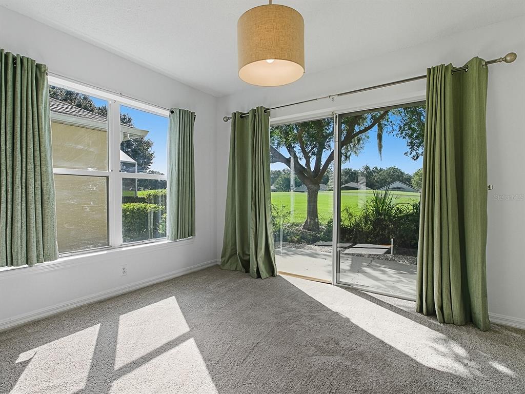 3016 Andover Court Mount Dora, FL 32757 - Photo 16 of 71 a view of a room with window wooden floor and door