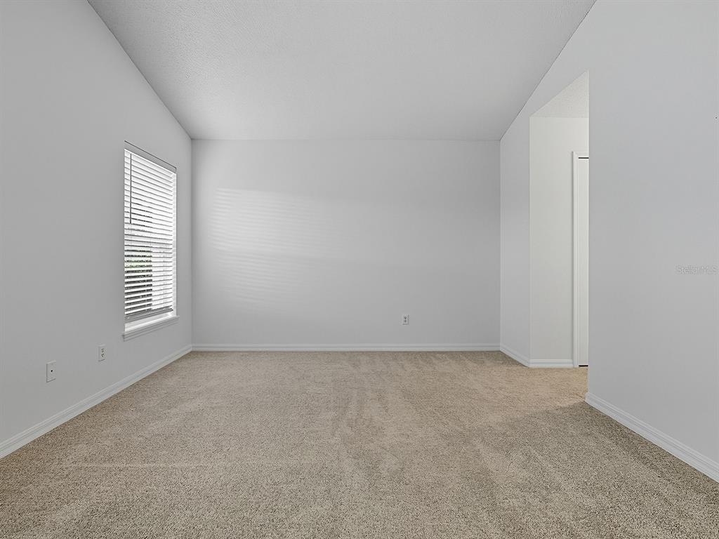 3016 Andover Court Mount Dora, FL 32757 - Photo 26 of 71 an empty room with windows