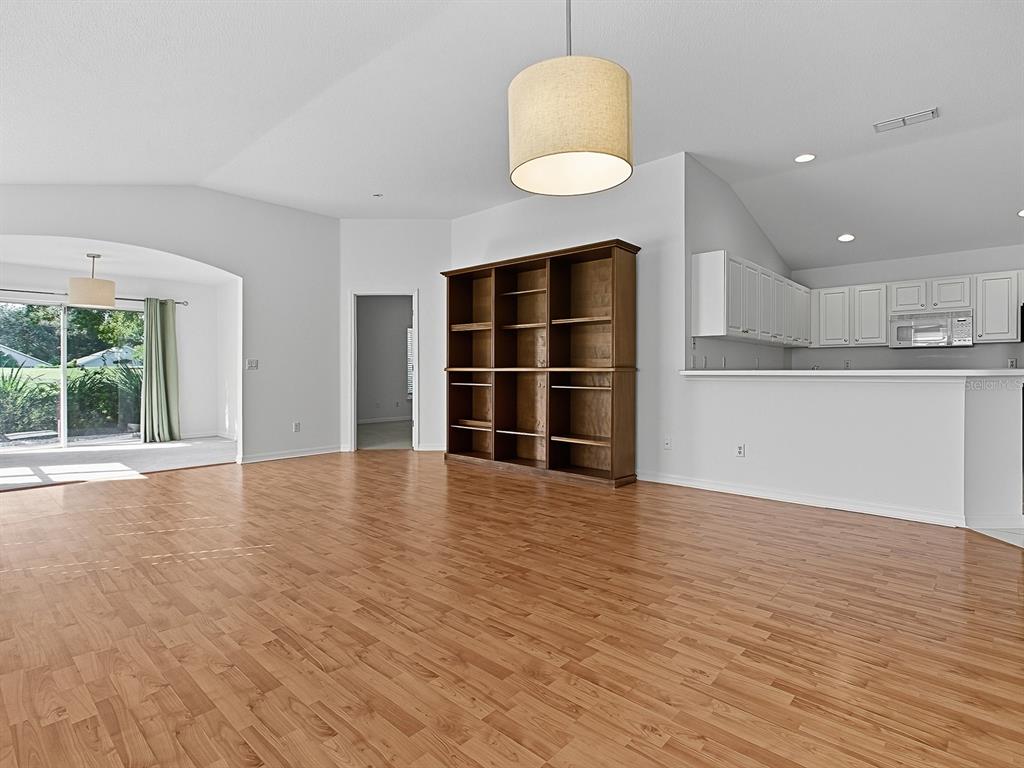 3016 Andover Court Mount Dora, FL 32757 - Photo 44 of 71 a view of a kitchen with wooden floor and a window