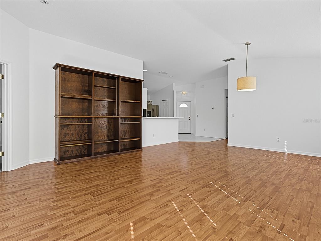 3016 Andover Court Mount Dora, FL 32757 - Photo 45 of 71 a view of empty room with wooden floor and window