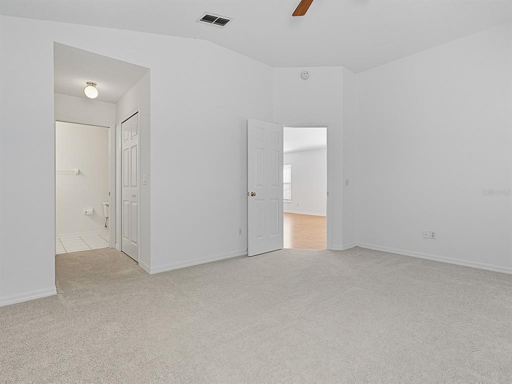 3016 Andover Court Mount Dora, FL 32757 - Photo 49 of 71 an empty room with an entryway