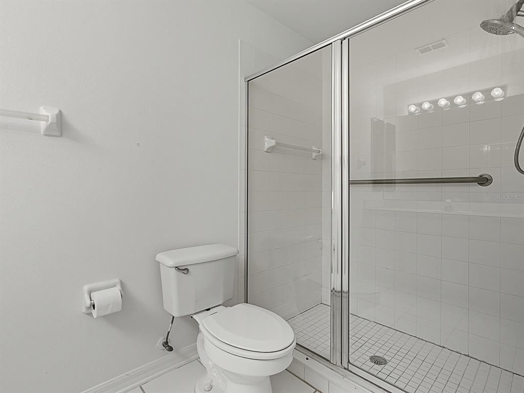 3016 Andover Court Mount Dora, FL 32757 - Photo 51 of 71 a bathroom with a toilet and a shower
