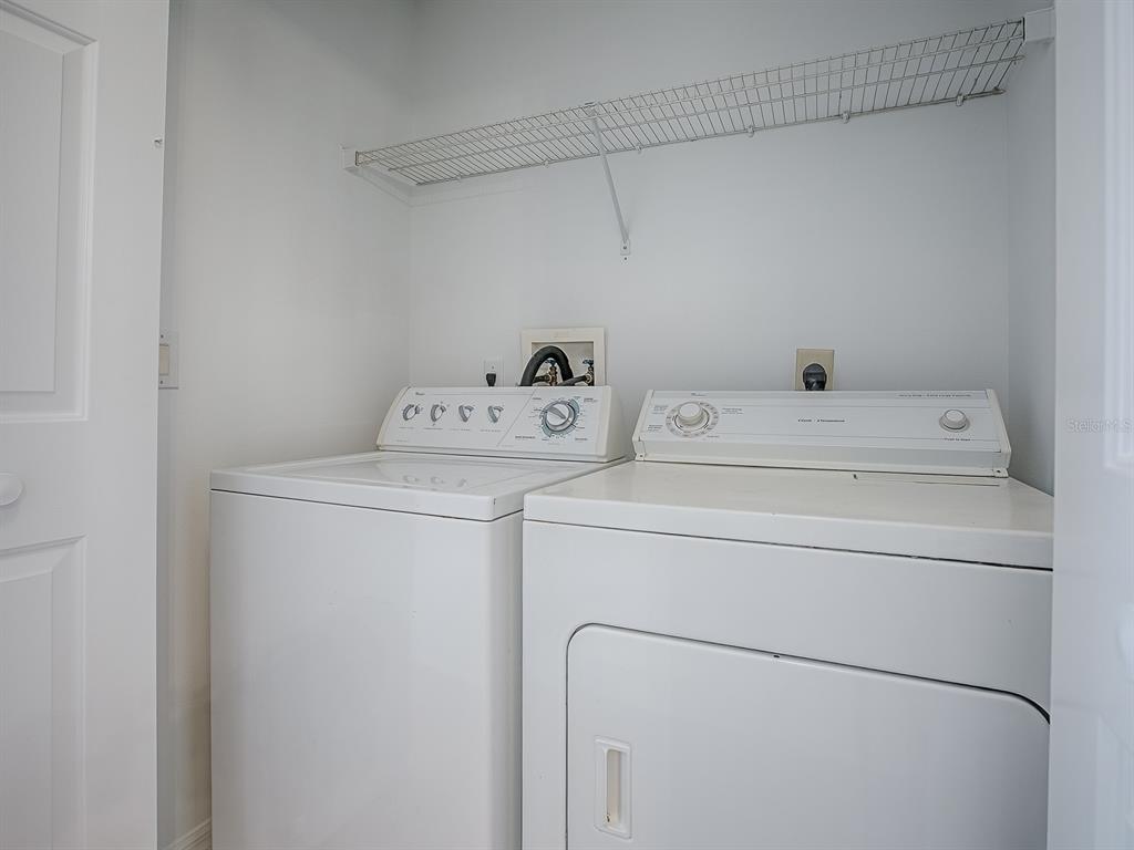3016 Andover Court Mount Dora, FL 32757 - Photo 56 of 71 a utility room with dryer and washer