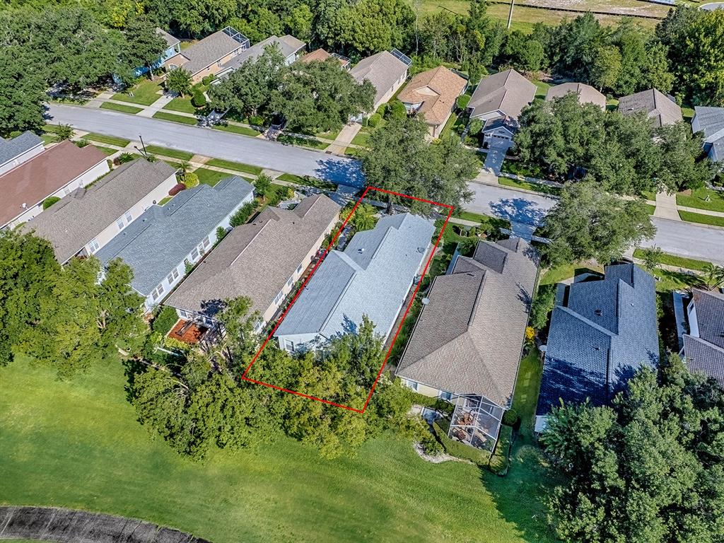 3016 Andover Court Mount Dora, FL 32757 - Photo 65 of 71 an aerial view of a house with a garden