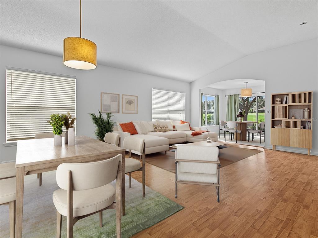 3016 Andover Court Mount Dora, FL 32757 - Photo 9 of 71 a living room with furniture a dining table and a potted plant