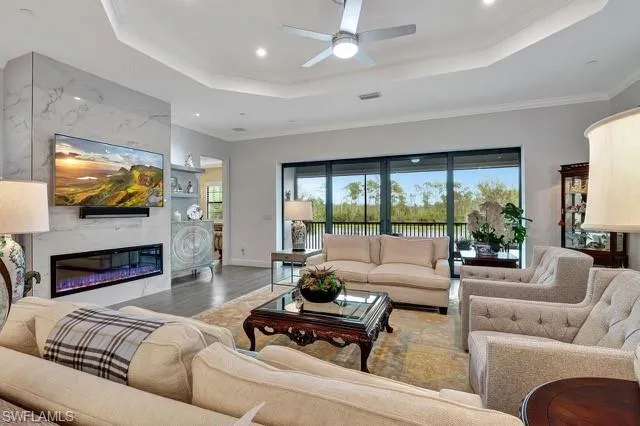 a living room with fireplace furniture and a flat screen tv