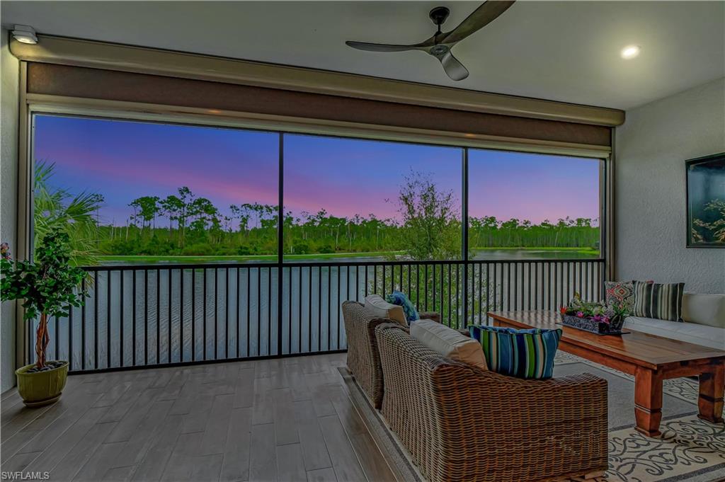 9637 Montelanico Loop, Unit 203 Naples, FL 34119 - Photo 11 of 50 Awesome twilight views of sweeping lake and preserves as seen from the family room. Not shown remote power screens