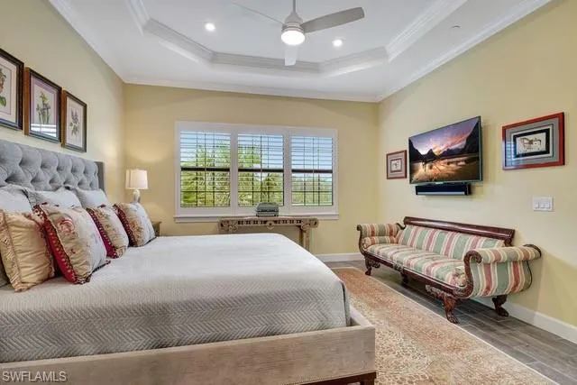 a spacious bedroom with a bed and a couch