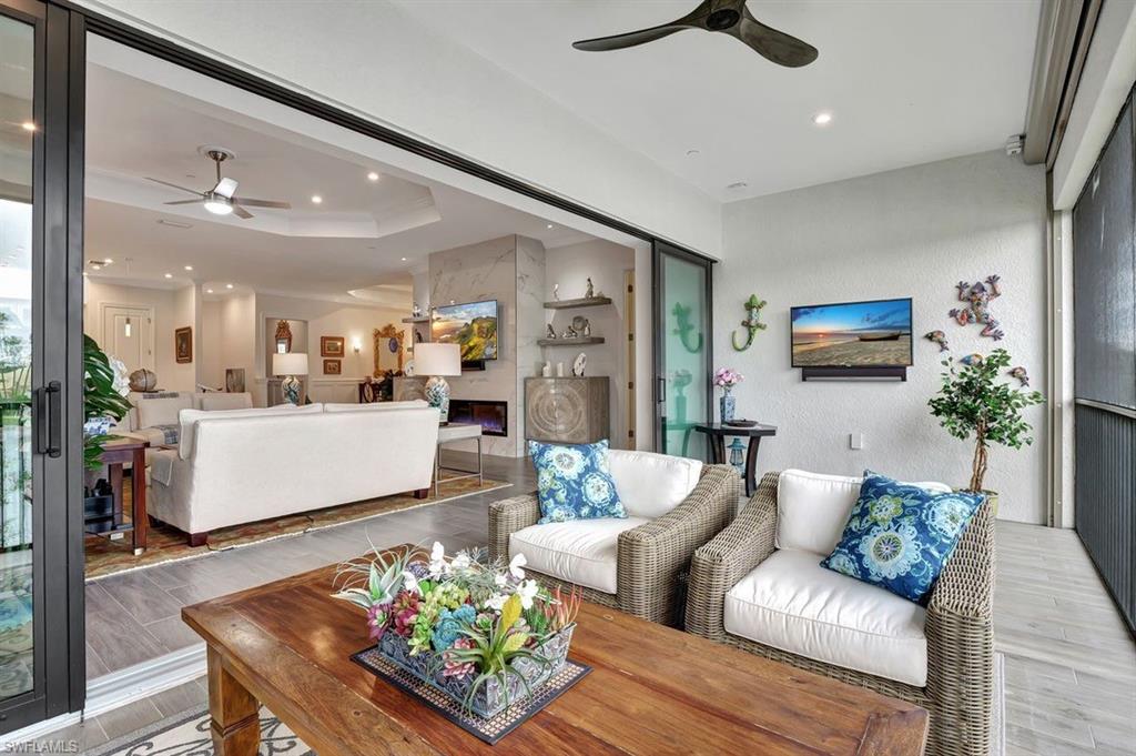 9637 Montelanico Loop, Unit 203 Naples, FL 34119 - Photo 18 of 50 View from lanai into the family room