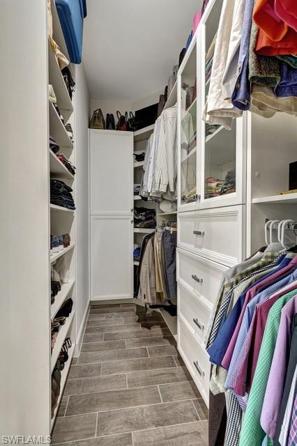 9637 Montelanico Loop, Unit 203 Naples, FL 34119 - Photo 24 of 50 Primary custom built walk-in-closet.