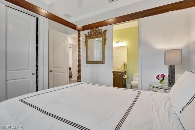 9637 Montelanico Loop, Unit 203 Naples, FL 34119 - Photo 26 of 50 Guest Bedroom 2 featuring crown moulding, ceiling fan, closet, and full bathroom.