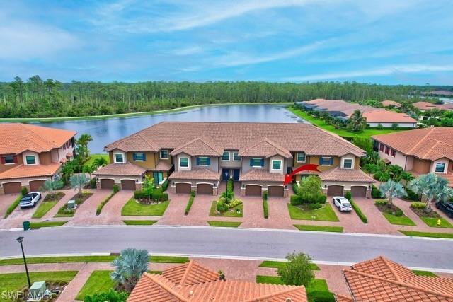 9637 Montelanico Loop, Unit 203 Naples, FL 34119 - Photo 3 of 50 Aerial view of building and surrounding neighborhood area featuring wide lake and preserve views