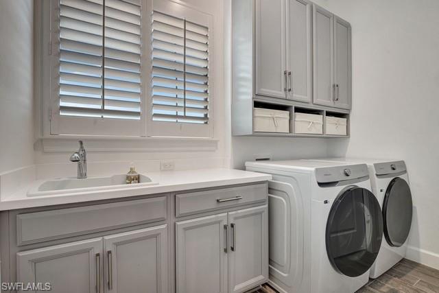 9637 Montelanico Loop, Unit 203 Naples, FL 34119 - Photo 34 of 50 Laundry room featuring washer and dryer, porcelain would like tile floors.