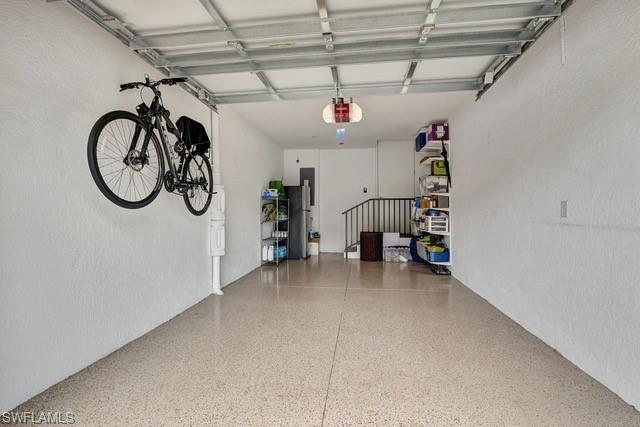 9637 Montelanico Loop, Unit 203 Naples, FL 34119 - Photo 35 of 50 One car attached features epoxy flooring