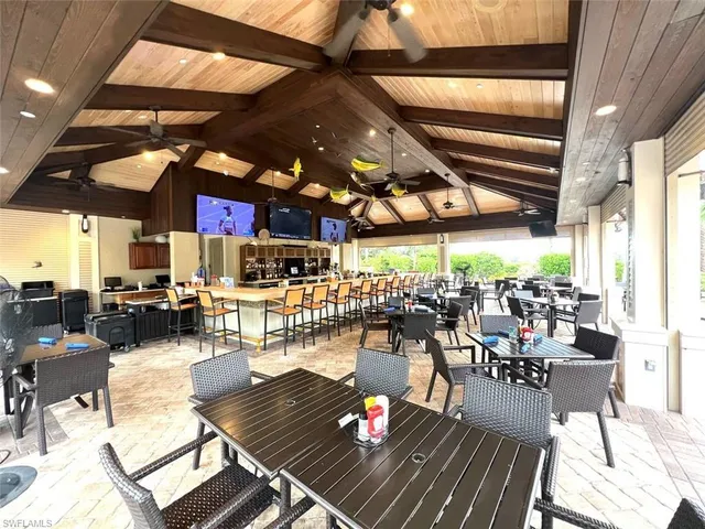 a view of a chairs and tables in a patio