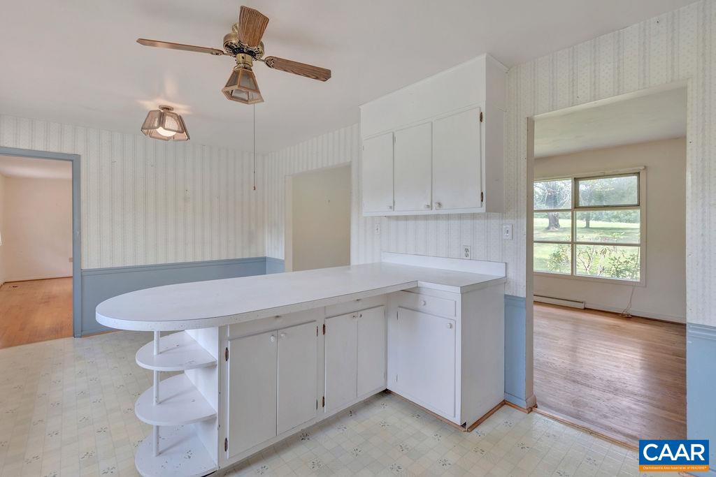 3605 Keswick Road Keswick, VA 22947 - Photo 21 of 35 a kitchen with a sink cabinets and wooden floor