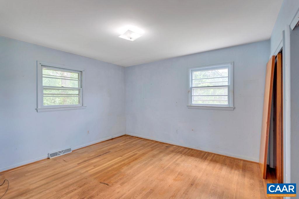 3605 Keswick Road Keswick, VA 22947 - Photo 27 of 35 a view of empty room with wooden floor and fan