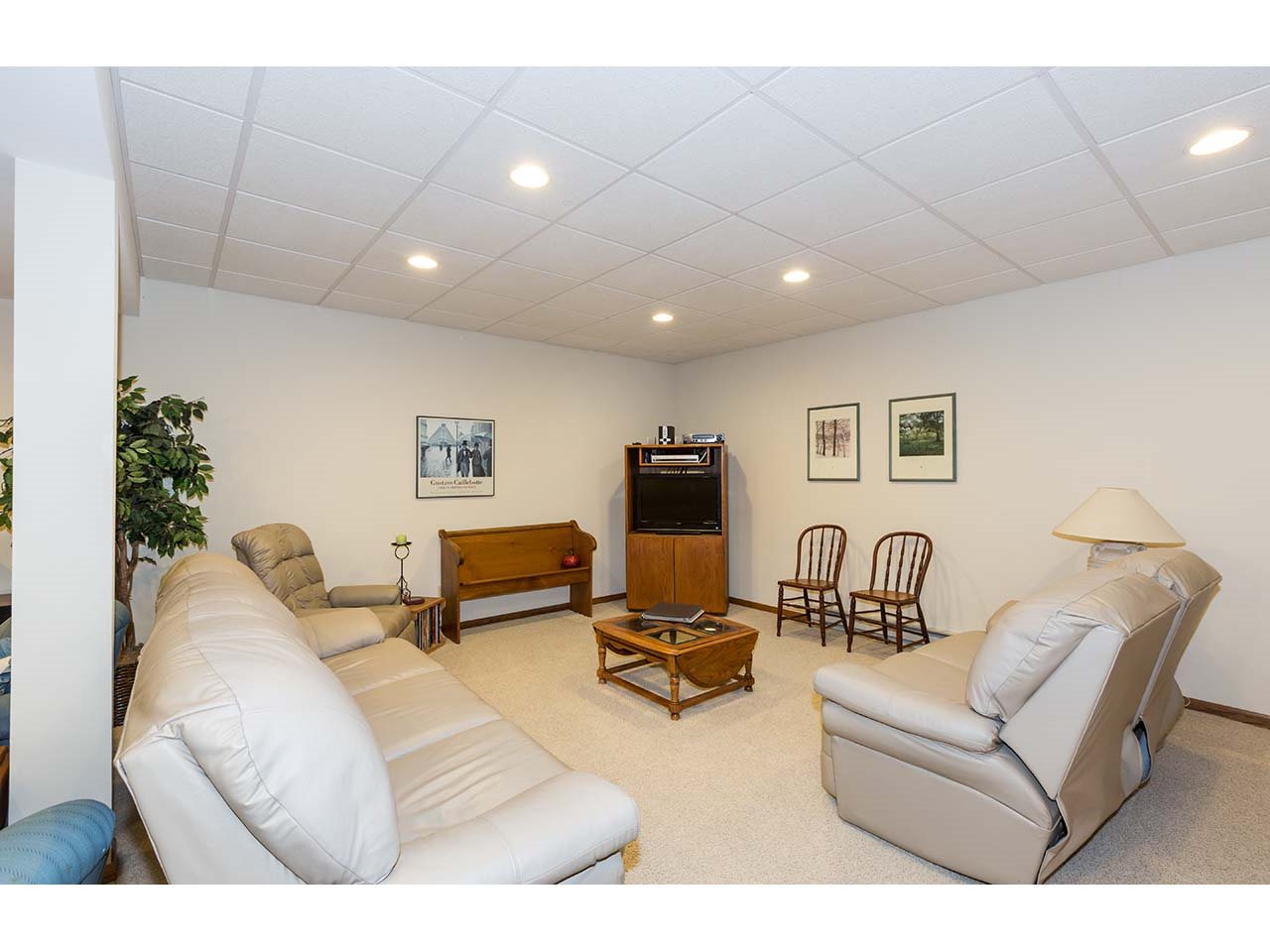 8761 Goeke Road Davis, IL 61019 - Photo 11 of 21 a living room with furniture and a flat screen tv