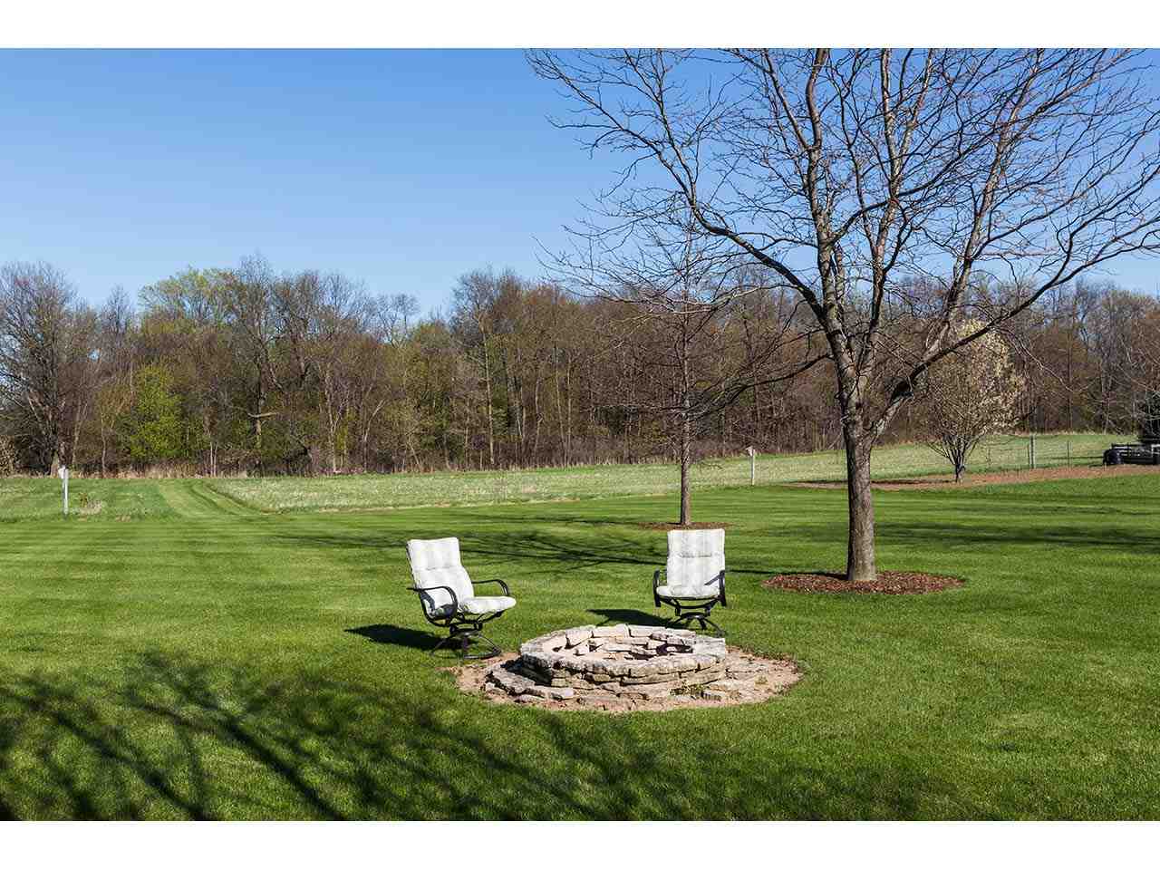 8761 Goeke Road Davis, IL 61019 - Photo 14 of 21 a backyard of a house with lots of green space