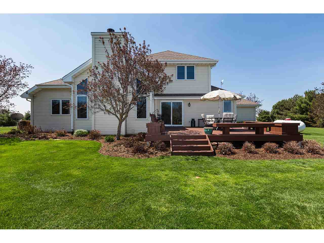 8761 Goeke Road Davis, IL 61019 - Photo 17 of 21 a view of a house with backyard sitting area and garden