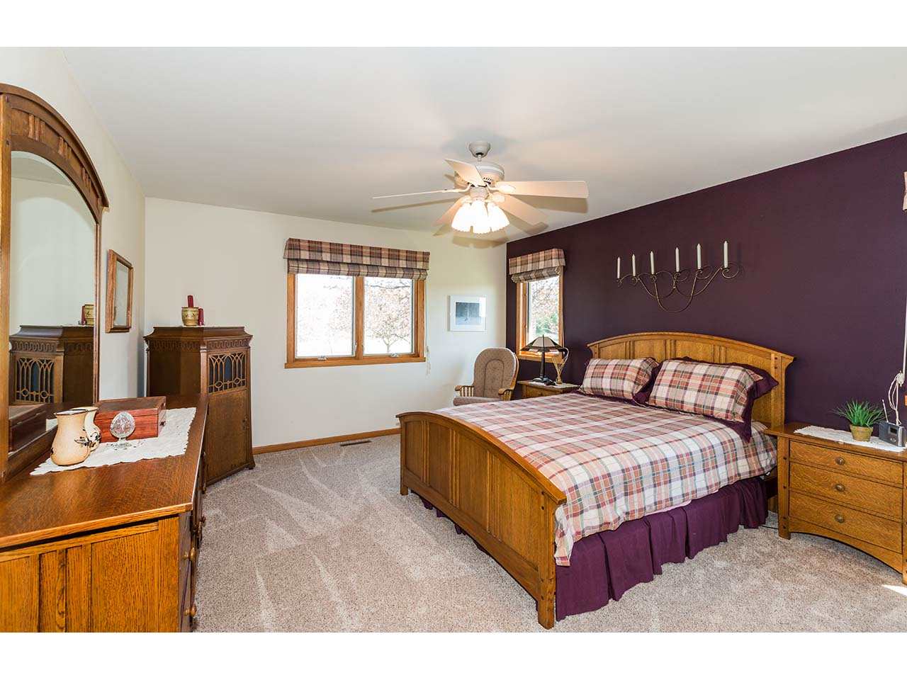 8761 Goeke Road Davis, IL 61019 - Photo 5 of 21 a bedroom with a bed and a chandelier