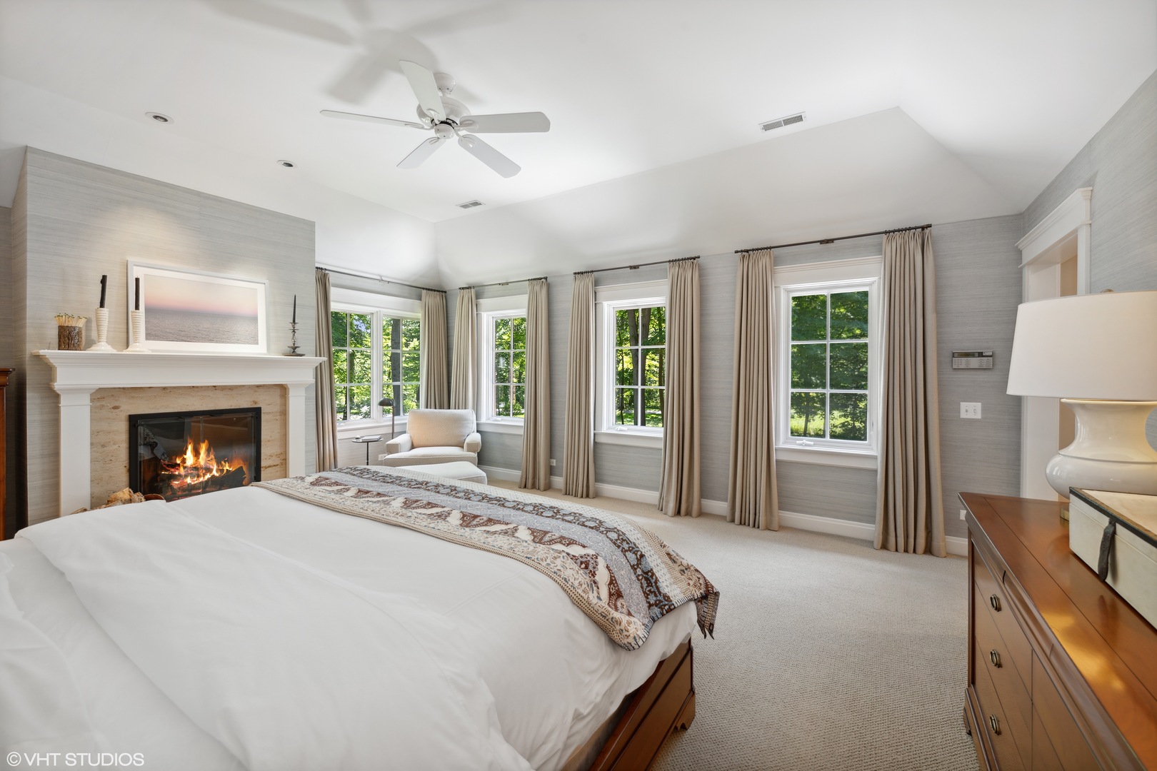 520 Forest Cove Road Lake Bluff, IL 60044 - Photo 19 of 48 a spacious bedroom with a bed and a fireplace