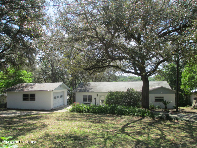 6444 Brooklyn Bay Road Keystone Heights, FL 32656 - Photo 1 of 32 a house that has a tree in front of it