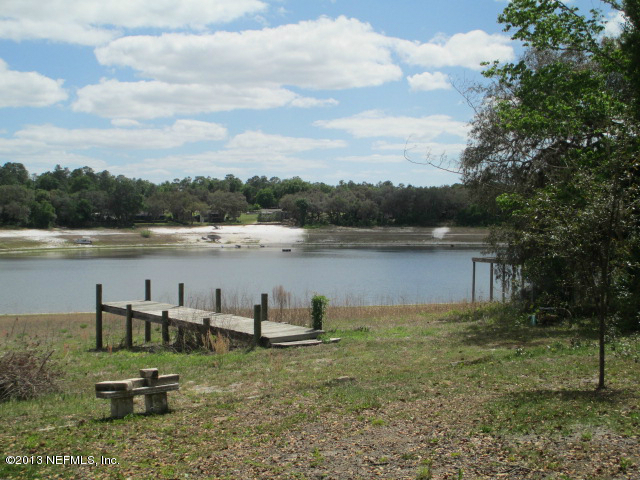 6444 Brooklyn Bay Road Keystone Heights, FL 32656 - Photo 12 of 32 a view of a lake with houses in the back
