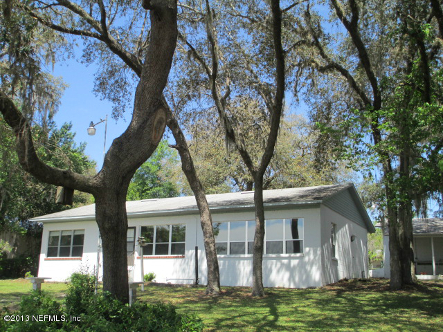 6444 Brooklyn Bay Road Keystone Heights, FL 32656 - Photo 25 of 32 a house that has tree in front of it
