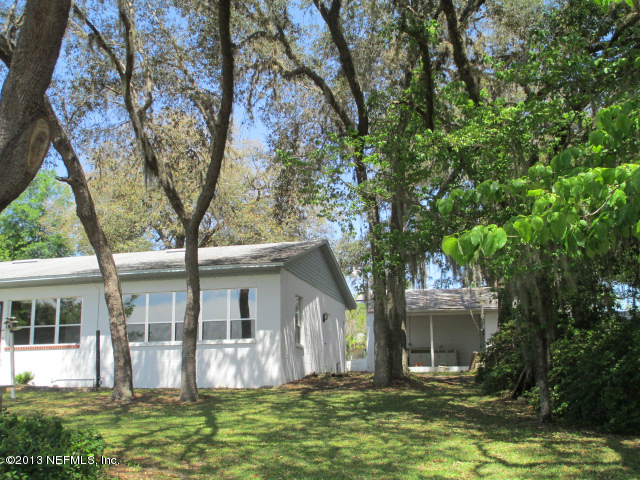 6444 Brooklyn Bay Road Keystone Heights, FL 32656 - Photo 26 of 32 a front view of house with yard and green space