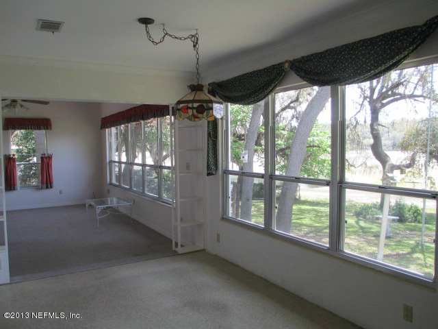 6444 Brooklyn Bay Road Keystone Heights, FL 32656 - Photo 6 of 32 a view of empty room with windows