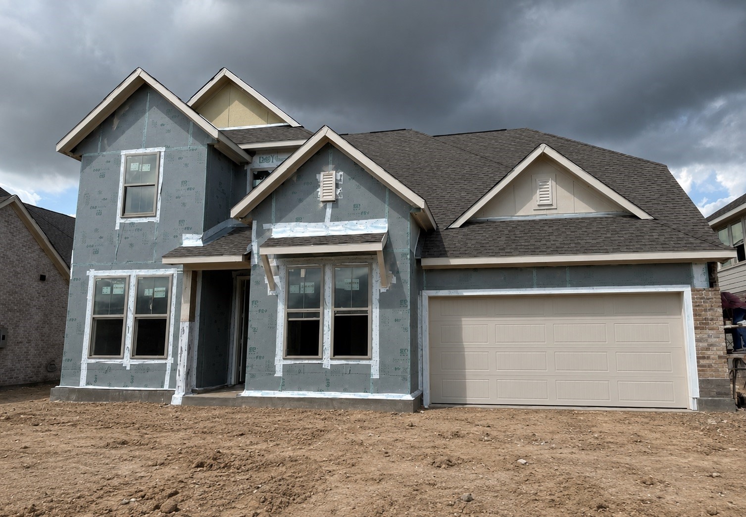 32119 Pond Pine Spring, TX 77386 - Photo 2 of 10 a front view of a house with a yard and garage