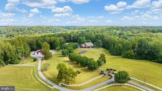 a view of a house with a yard and street view