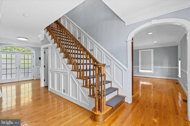a view of a walk in closet and a bathroom