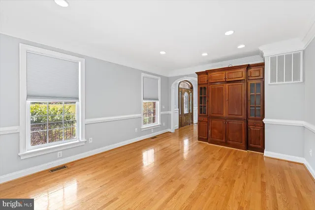a view of granite countertop white cabinets with granite countertop stainless steel appliances granite countertop a sink and dishwasher a granite countertops with wooden floor