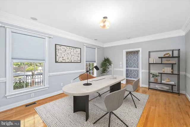 a view of a dining room with furniture window and wooden floor