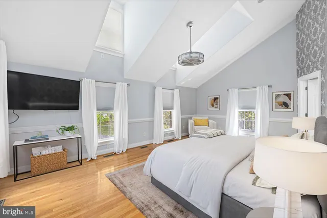 a bathroom with a granite countertop sink a mirror and vanity