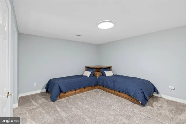 a view of a house with swimming pool and sitting area