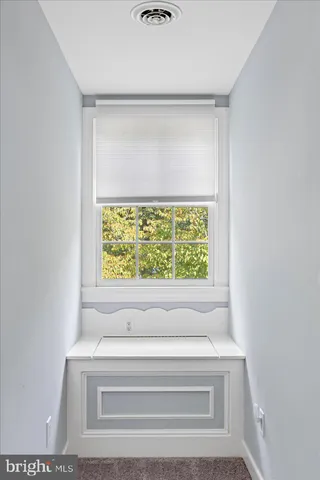 a view of a swimming pool with a yard