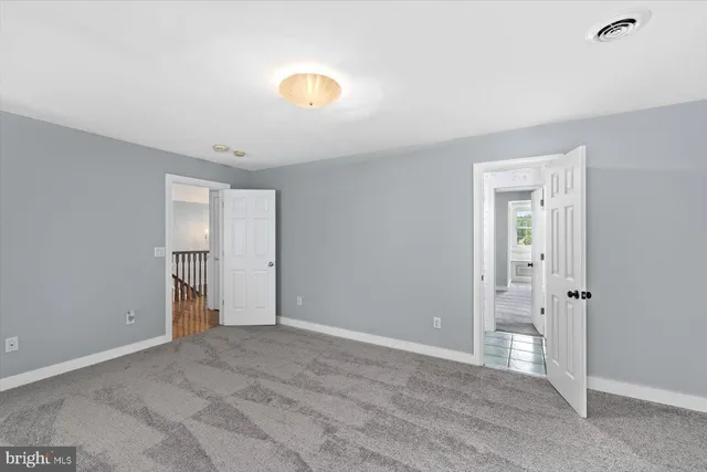 a view of a swimming pool with a patio and a yard