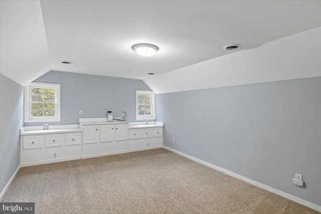 a view of a big yard with swimming pool and green space