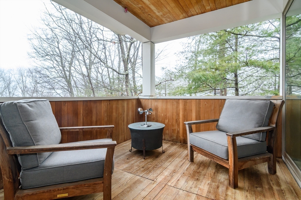 41 Grove Street Wayland, MA 01778 - Photo 19 of 24 a outdoor sitting area with a large window