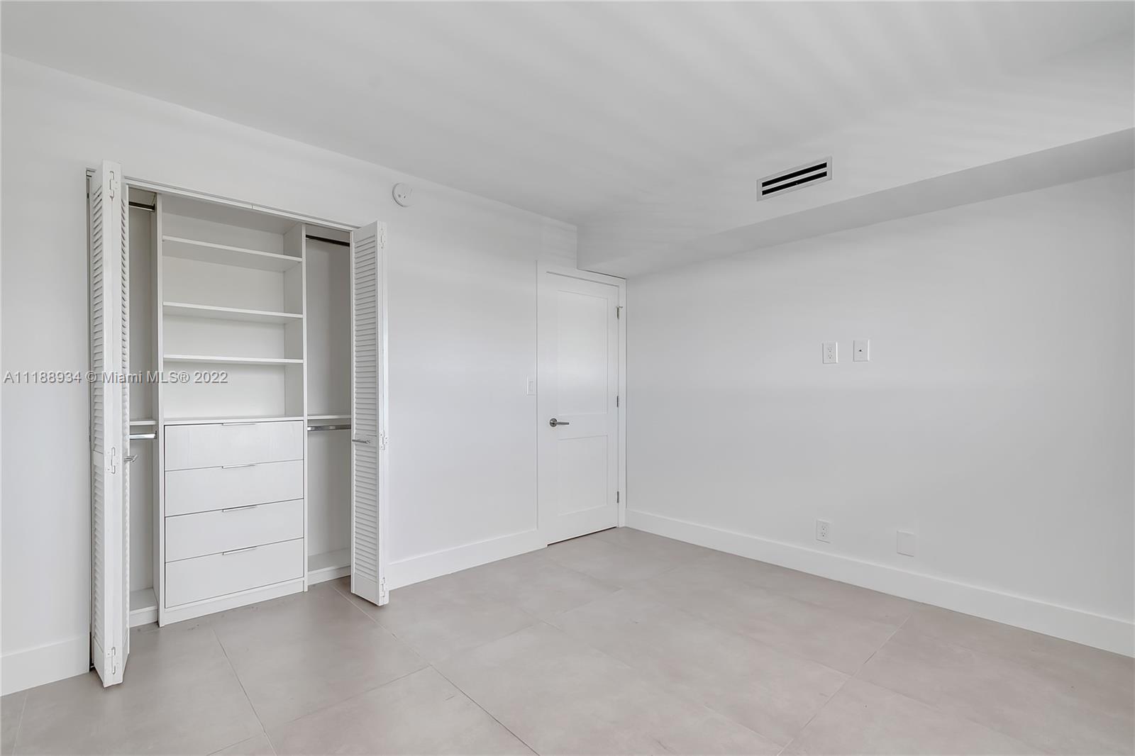 240 Galen Drive, Unit 308 Key Biscayne, FL 33149 - Photo 15 of 22 a view of an empty room and closet area