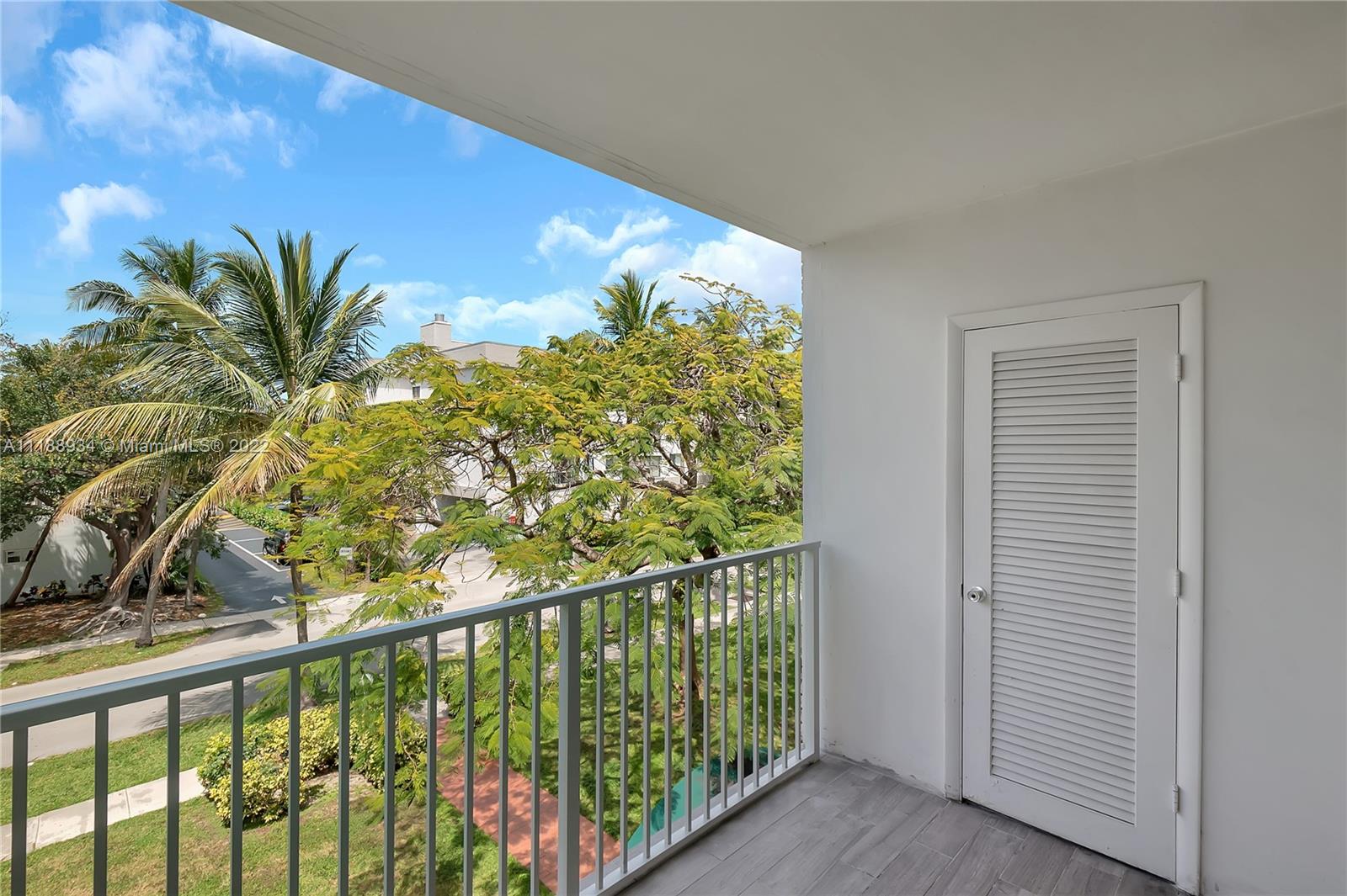 240 Galen Drive, Unit 308 Key Biscayne, FL 33149 - Photo 19 of 22 a view of a balcony with plants