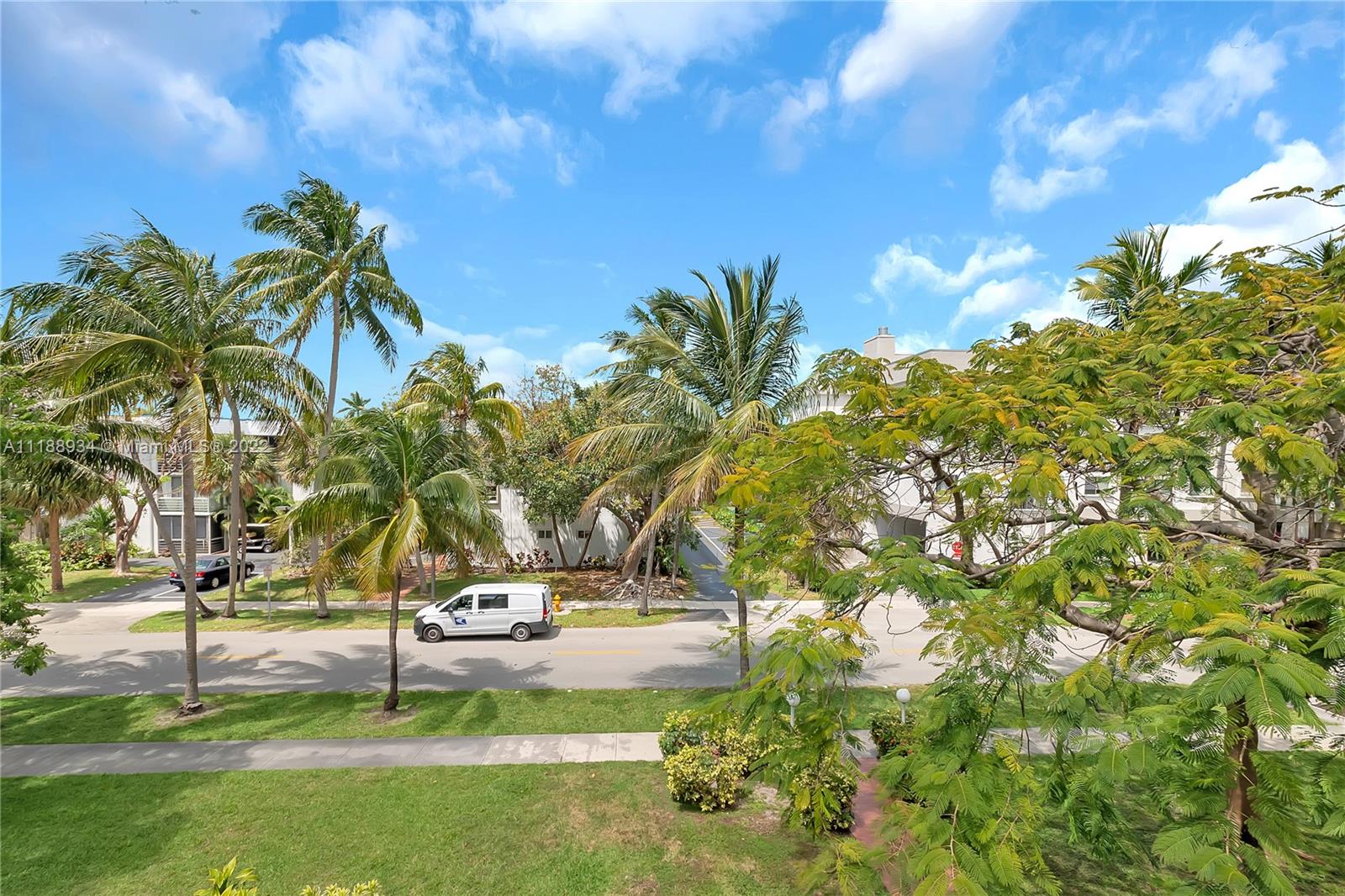 240 Galen Drive, Unit 308 Key Biscayne, FL 33149 - Photo 21 of 22 a view of a yard with plants and trees
