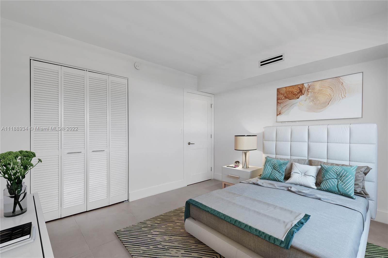 240 Galen Drive, Unit 308 Key Biscayne, FL 33149 - Photo 4 of 22 a bed room with a bed and a potted plant