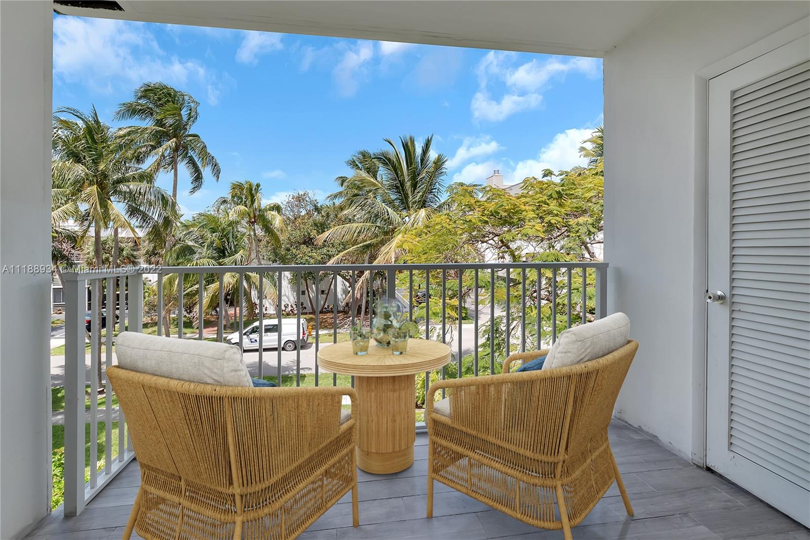 240 Galen Drive, Unit 308 Key Biscayne, FL 33149 - Photo 10 of 22 a view of a chair and table in the balcony
