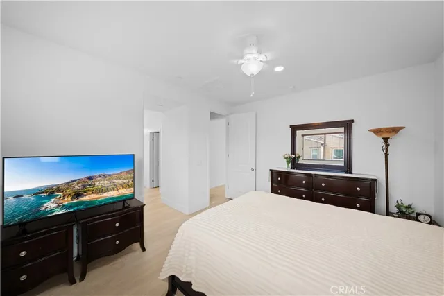 a bedroom with a bed and a dresser